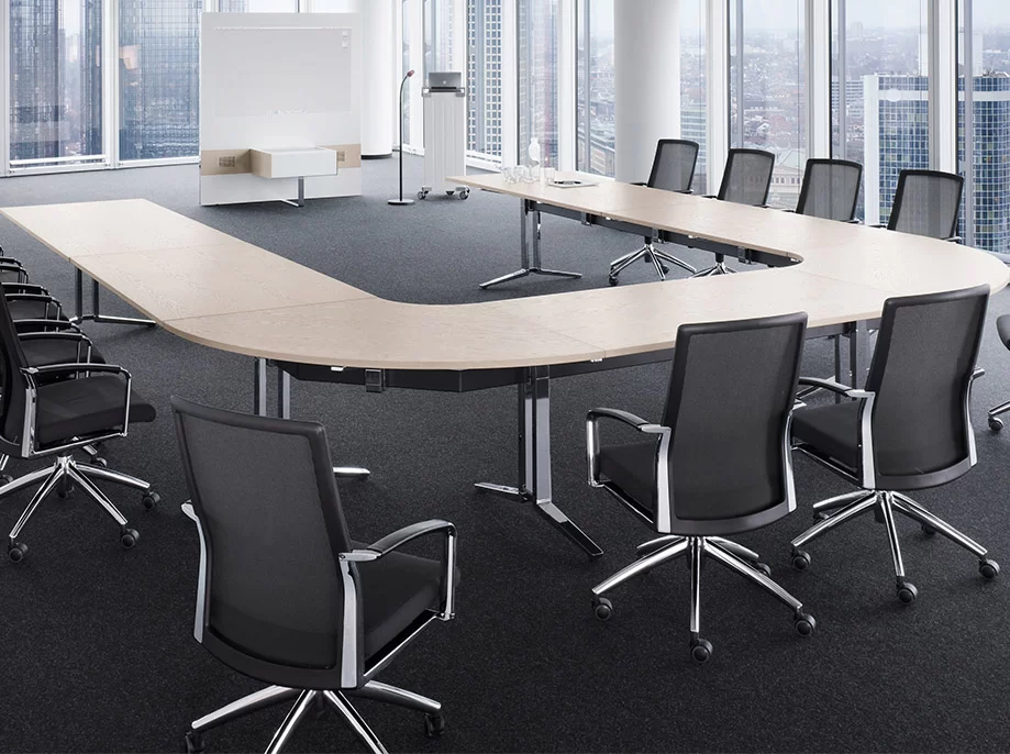 Co-working spaces that need compact huddle tables with integrated charging options